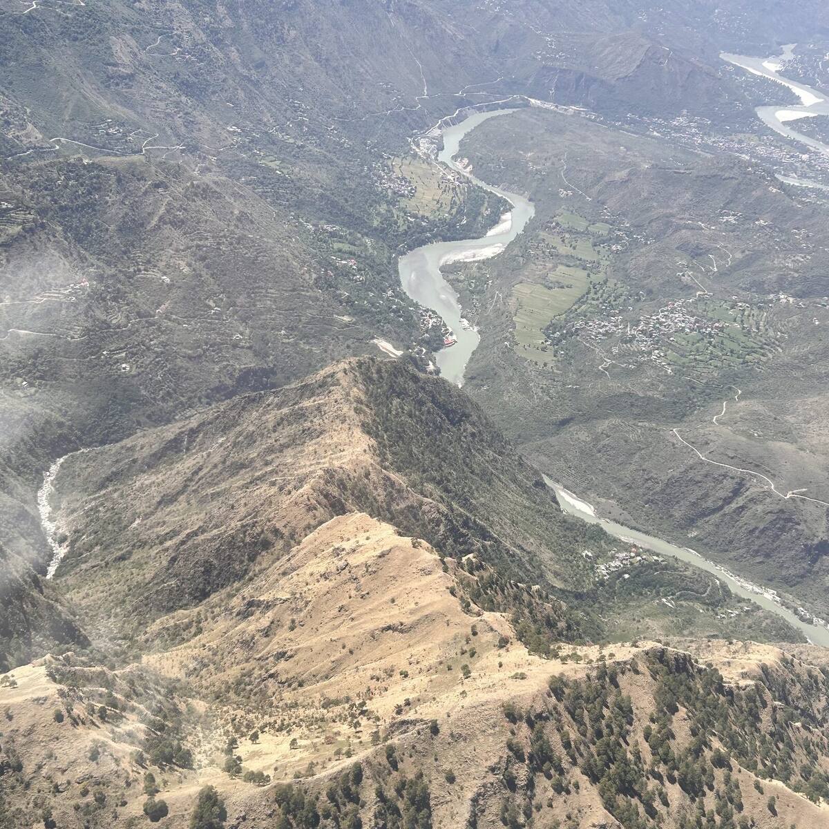 Sutlej river curves through gorge from aerial perspective